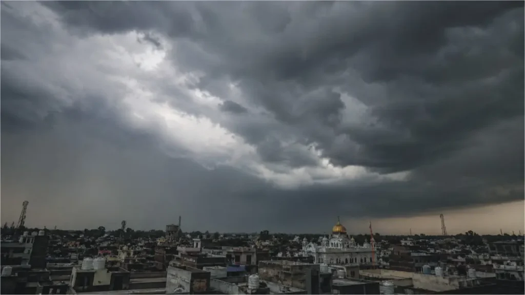Massive storm clouds and rain over a city in Punjab during the PDMA weather alert