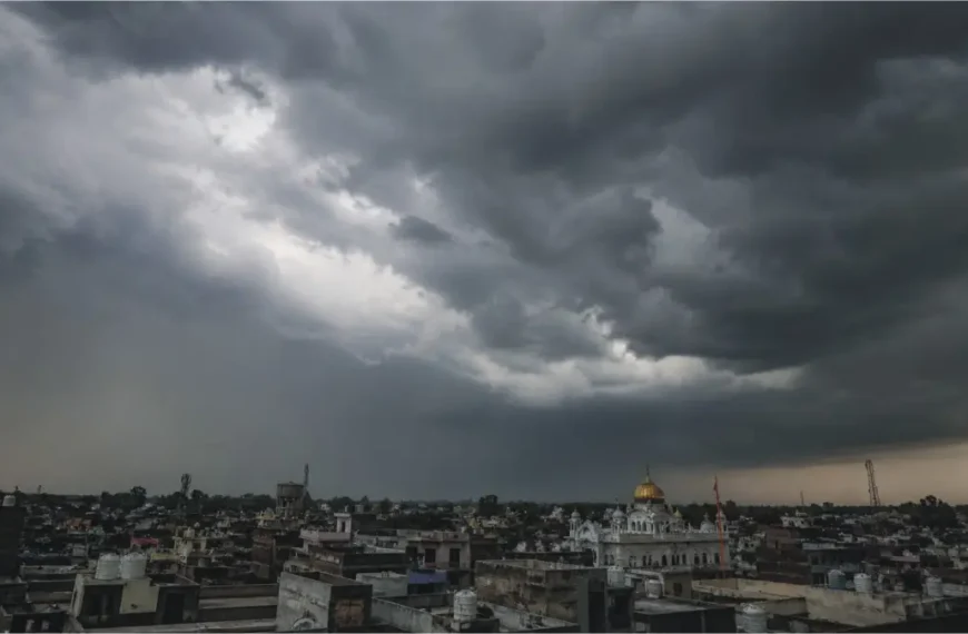 Massive storm clouds and rain over a city in Punjab during the PDMA weather alert