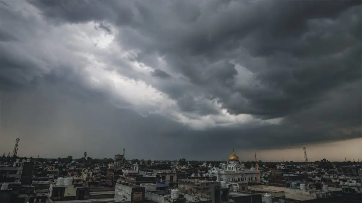 Massive storm clouds and rain over a city in Punjab during the PDMA weather alert