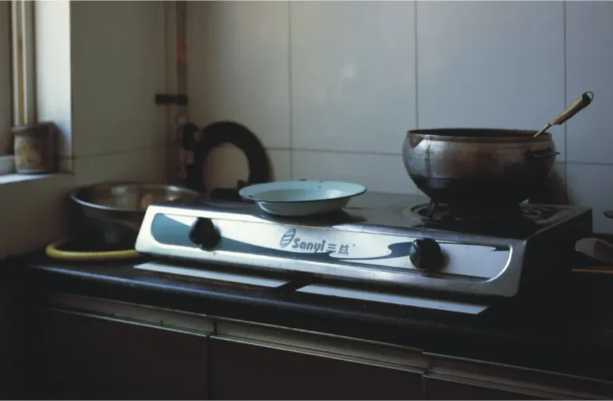 a pakistani home kitchen, stove without gas, no fire to cook food